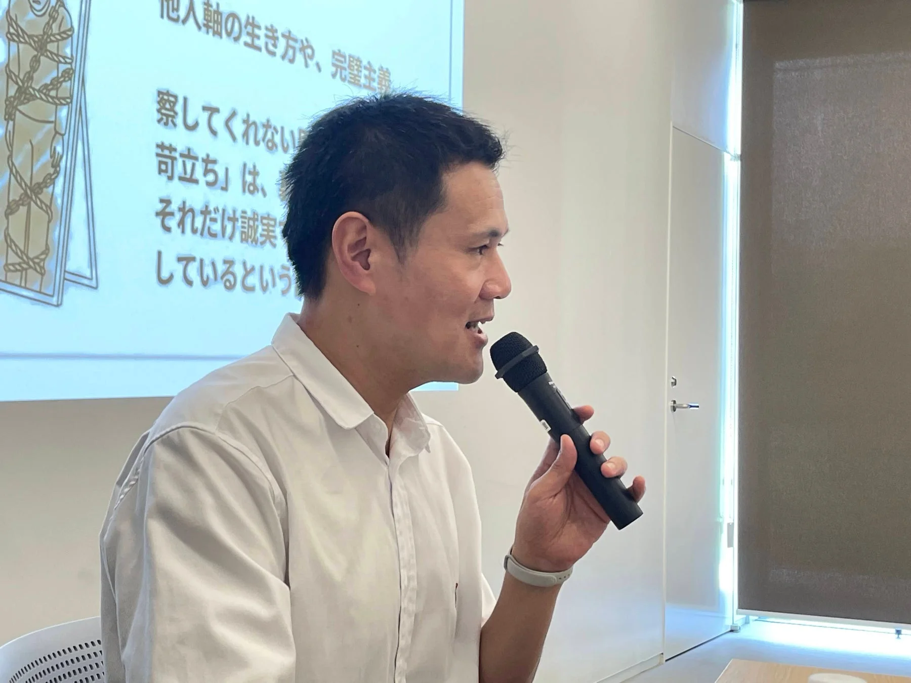 講演中のTomy氏